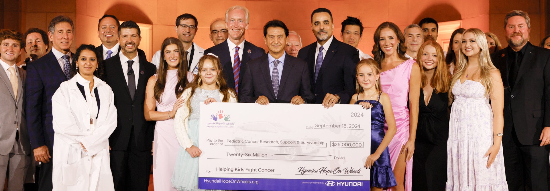 helping kids fight cancer foundation showing their big check from hyundai hope on wheels - Hamilton Hyundai in Clovis NM