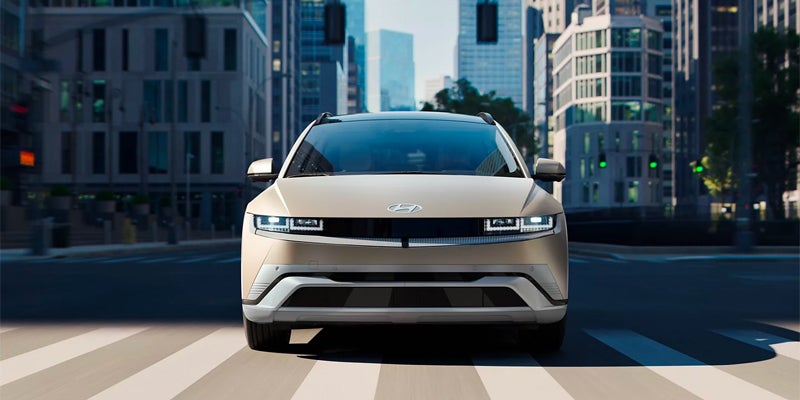 electric car front view in city street