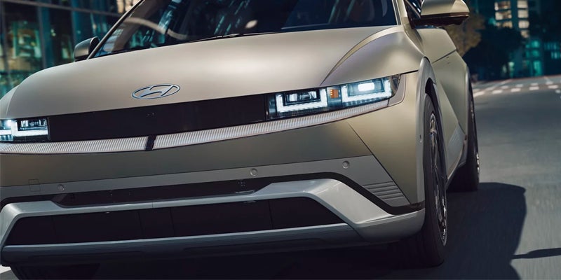 electric vehicle front headlight and grille closeup