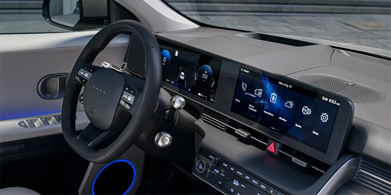 electric car interior dashboard steering and touchscreen display